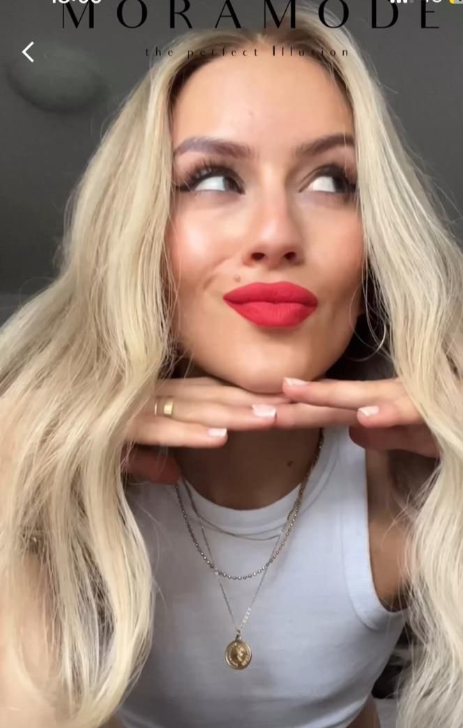 Coco, a blonde ombre deluxe lace wig with a money-piece highlight framing the face